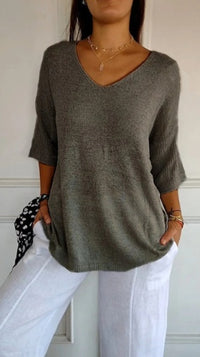 Effen gebreide damesblouse met 3/4 mouwen en V-hals