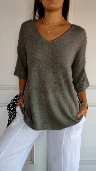 Effen gebreide damesblouse met 3/4 mouwen en V-hals