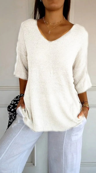 Effen gebreide damesblouse met 3/4 mouwen en V-hals