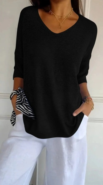 Effen gebreide damesblouse met 3/4 mouwen en V-hals